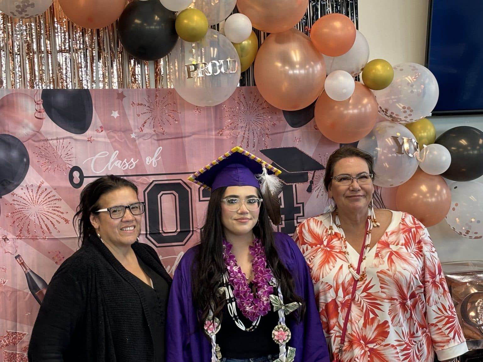 Blanca Windy Boy (right), Alexandrea Brugh (center) and Jodi Spotted Bear, celebrate Alexandrea’s May 26, 2024 graduation from New Town High School. (Photo Credit, James Brugh)