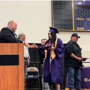 Alexandrea Brugh receives her high school diploma during New Town High School Graduation on May 26, 2024. (Photo Credit, James Brugh)