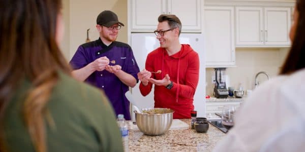 Chef Zach Baillie [left] teaches a cooking class at Main Street Boutique in Rugby during Hepola’s recent shooting. Baillie is also the lead chef at the local hospital.