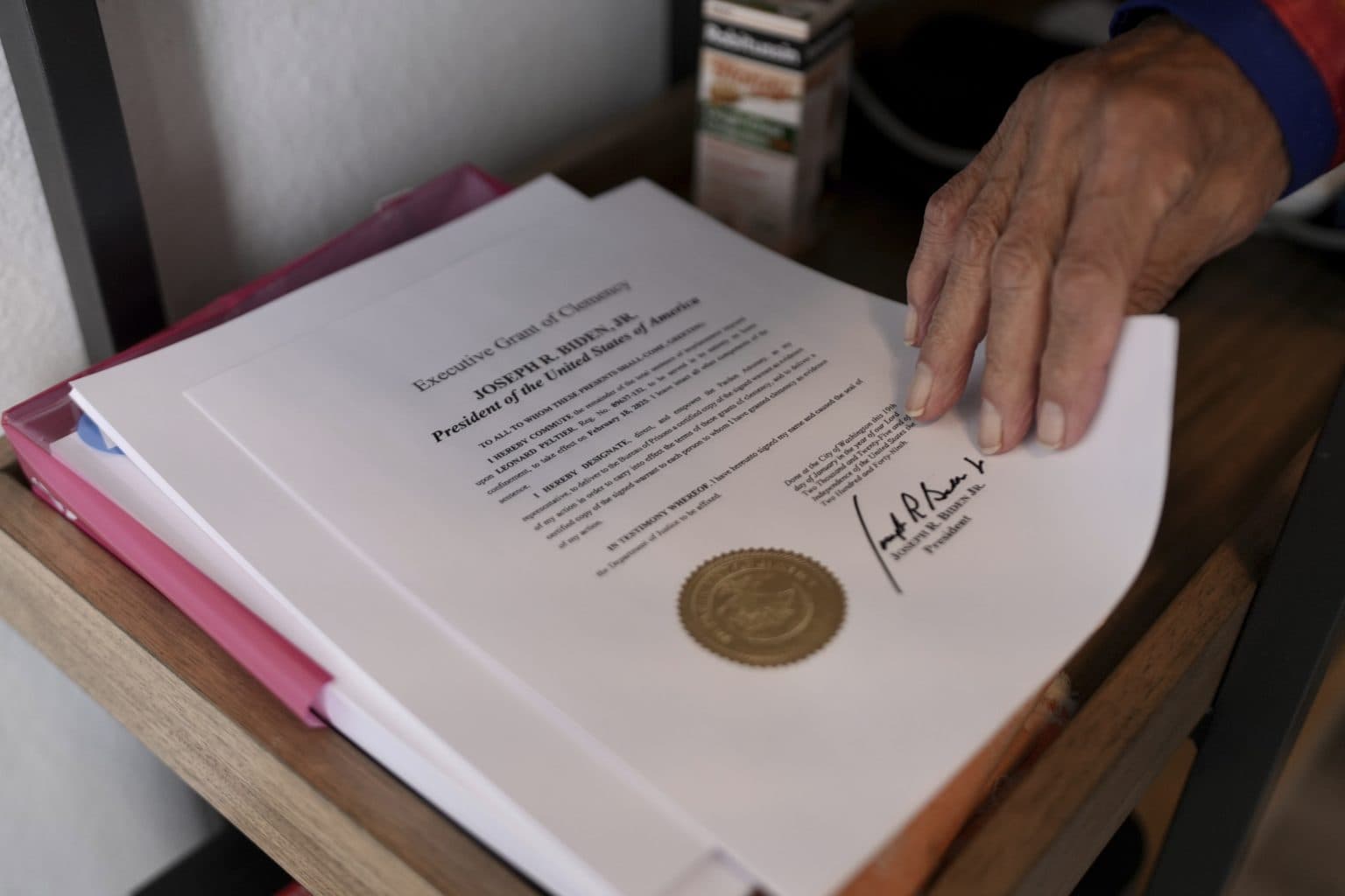 Leonard Peltier holds a copy of his commutation in Belcourt, N.D, on Tuesday, Feb. 25, 2025.