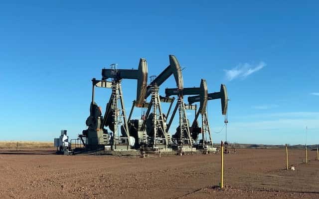 Pump jacks on well pad sites such as these in December 2020 are a common scene in western North Dakota, where more than 16,000 wells have been drilled since 2007. The Bakken and Three Forks shale formations have made the state the second-highest producer of oil in the United States. It’s estimated that 20 percent of oil production occurs within the Fort Berthold Reservation. (Photo by Jodi Rave Spotted Bear/Buffalo's Fire)