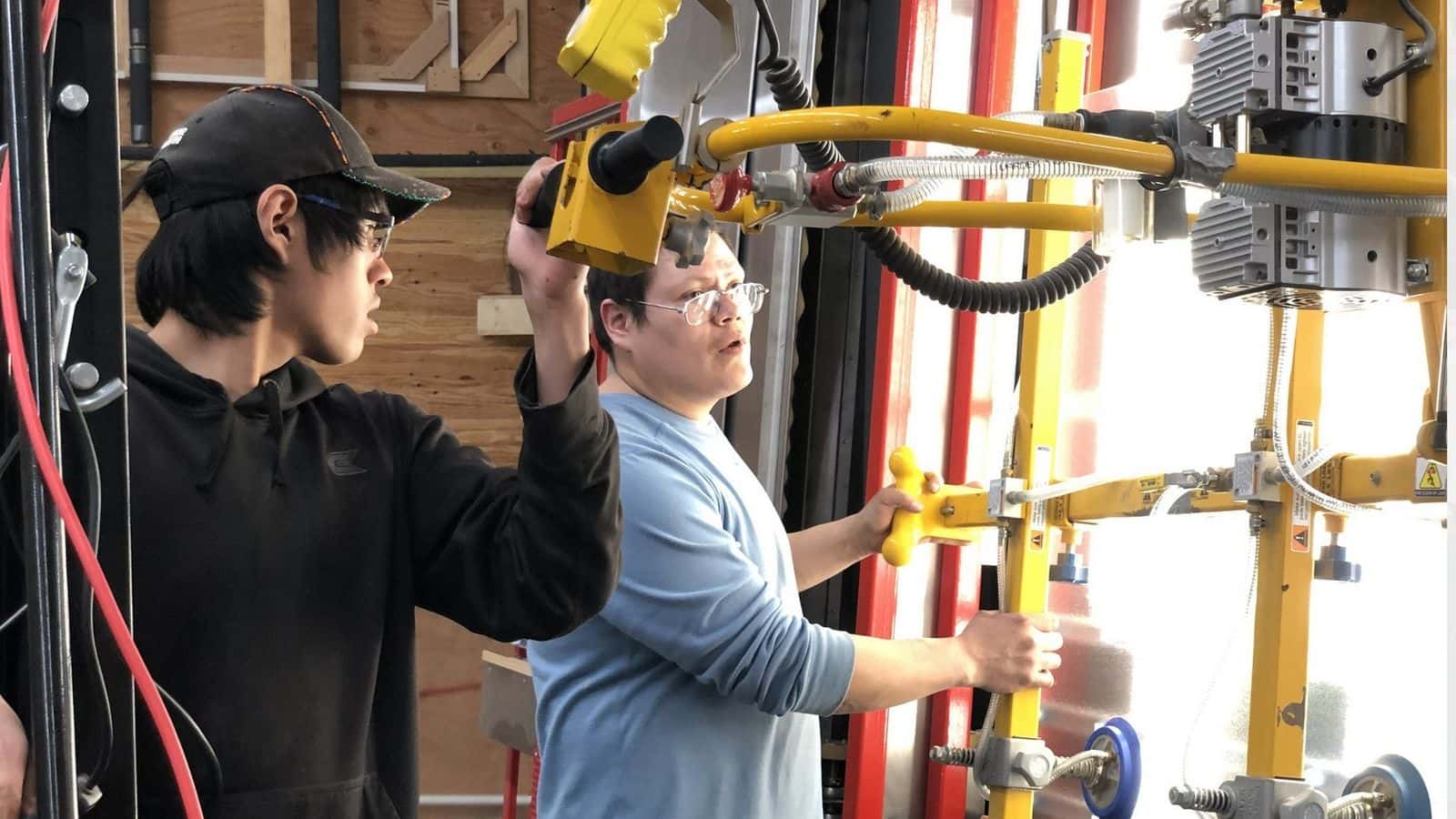 Employees at 8th Fire Solar construct thermal solar panels in Ponsford, Minn. The company is an arm of Akiing Community Development Corporation, an enity of the nonprofit organization Honor the Earth. PHOTO CREDIT/AKIING 8TH FIRE SOLAR