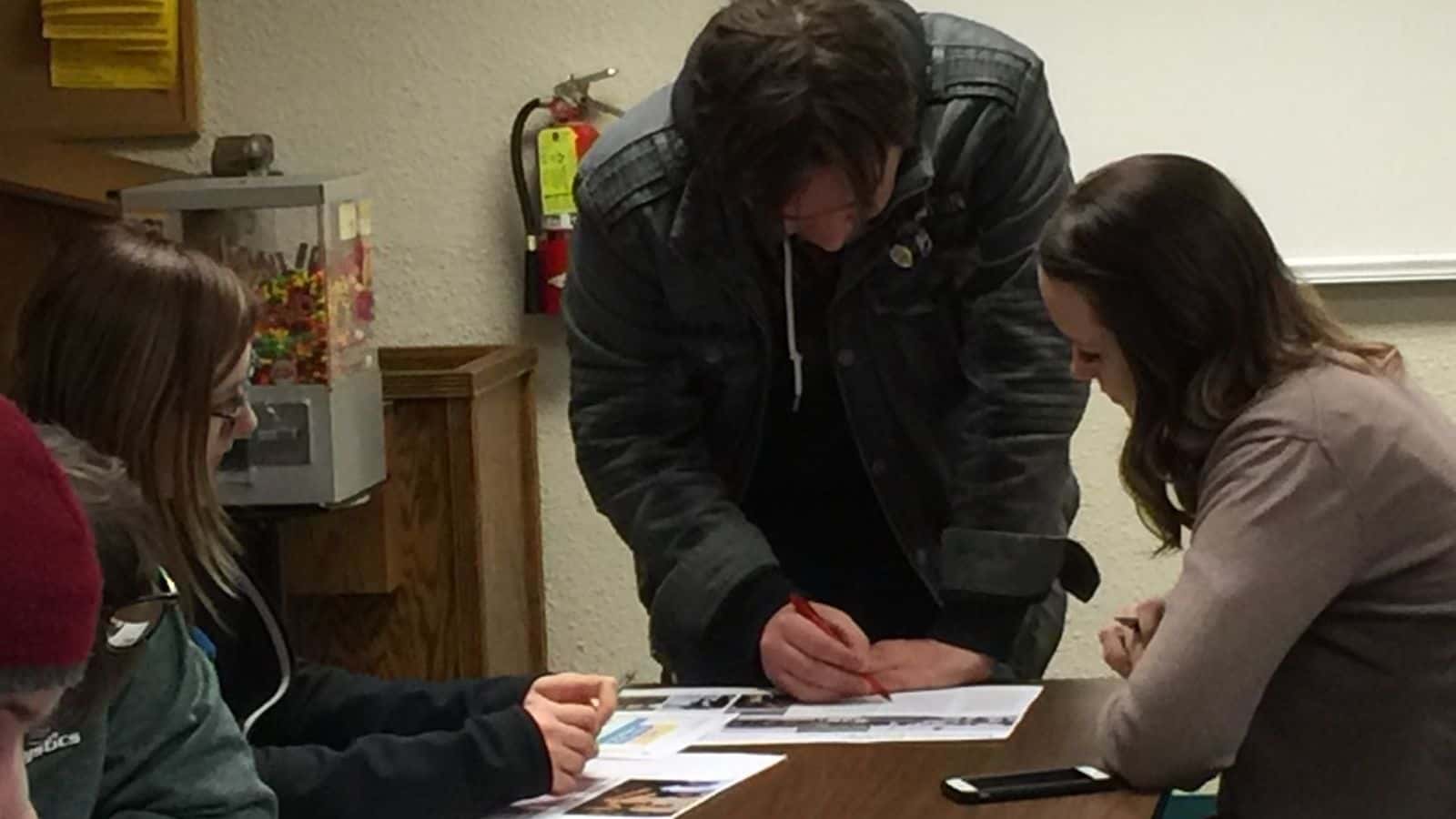 Brett Williamson worked as a feature reporter for Bismarck State College’s student newspaper, The Mystician. In this 2016 photo, he edits an article with Katie Winbauer, the former editor-in-chief.