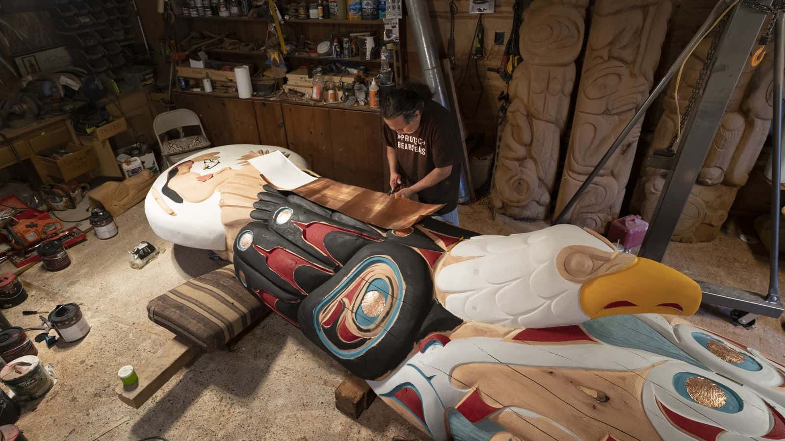 A carver works on turning a 400-year-old red cedar tree into the totem pole carried from Washington state to Washington D.C. on the Red Road to D.C.
PHOTO BY/ Red Road to D.C.