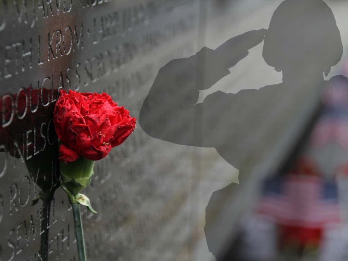 Vietnam Memorial and saluting soldier - photo created by Sara Marcum