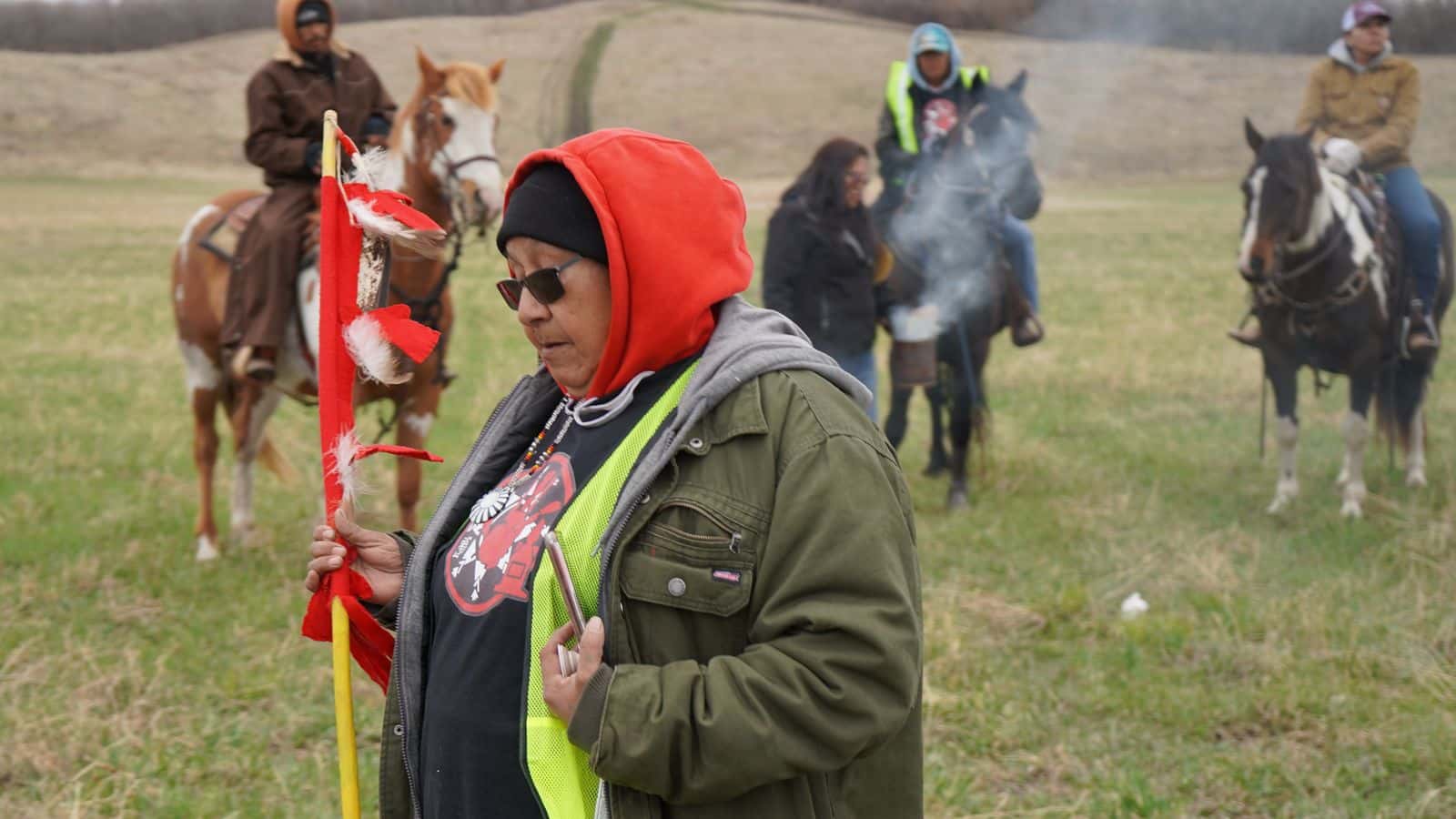 Alva Cottonwood-Gabe of Standing Rock MMIR and Horse Nation, two Standing Rock citizen groups, stands with Horse Nation Riders as they burn sage and prepare to search the treeline for missing Spirit Lake residents Jemini Posey and Isaac Hunt April 27, 2024. (Photo Credit/Alicia Hegland-Thorpe)
