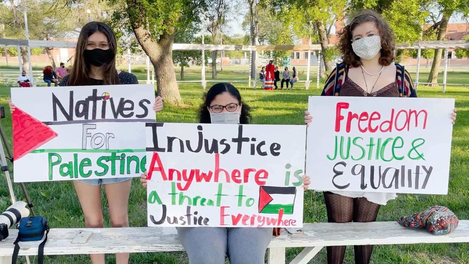 Students with signs advocating for Palestine. Photo by Georgiana Ausan