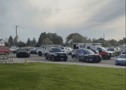Police cars on the scene at the Mountrail-Williams Electric Cooperative annual meeting in New Town, N.D. after threats of violence were made against American Indians.