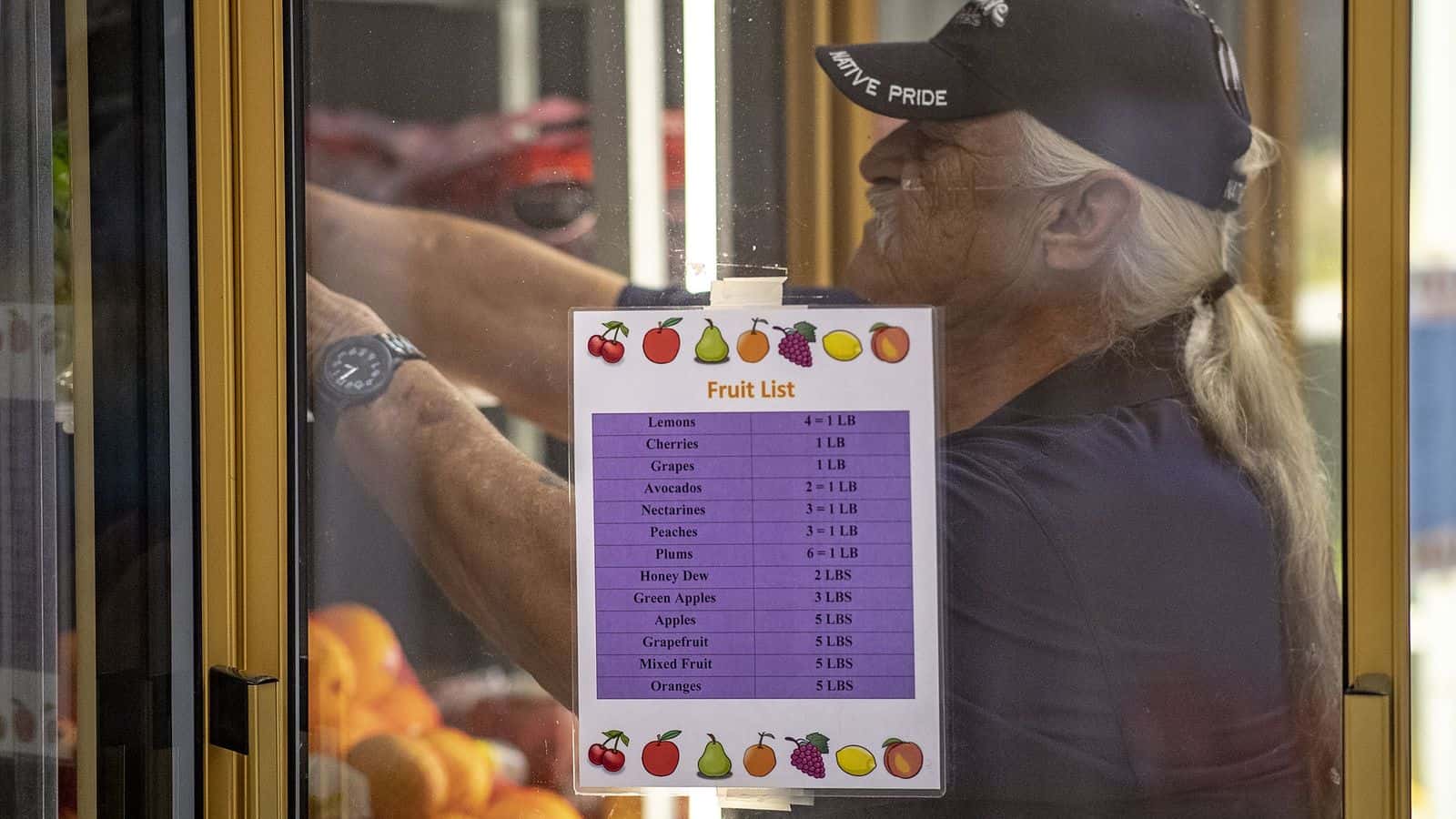Warehouse worker Robert Paschal stocks a cooler with fresh produce at the Food Distribution Program at Seminole Nation of Oklahoma, Nov. 6, 2018. (Photo by Preston Keres/U.S. Department of Agriculture)