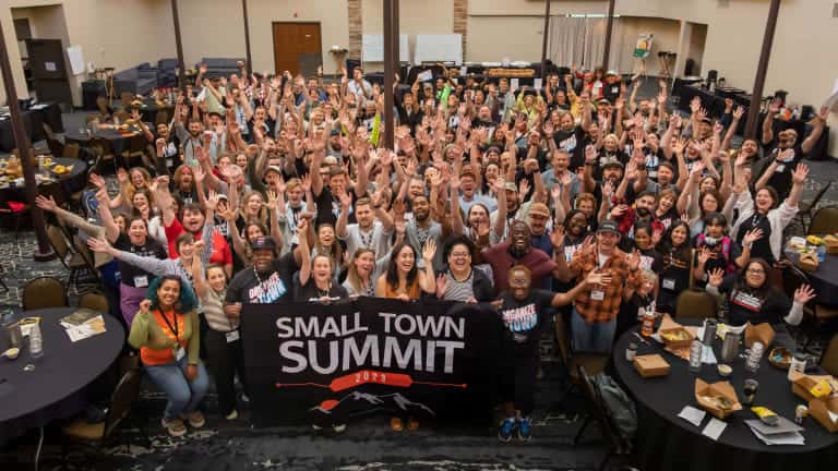 Participants pose together for a photo at the Holiday Inn during the first Small Town Summits last day in Missoula, Mont. on Wednesday June 7th, 2023. (Photo by Andrew Kemmis)