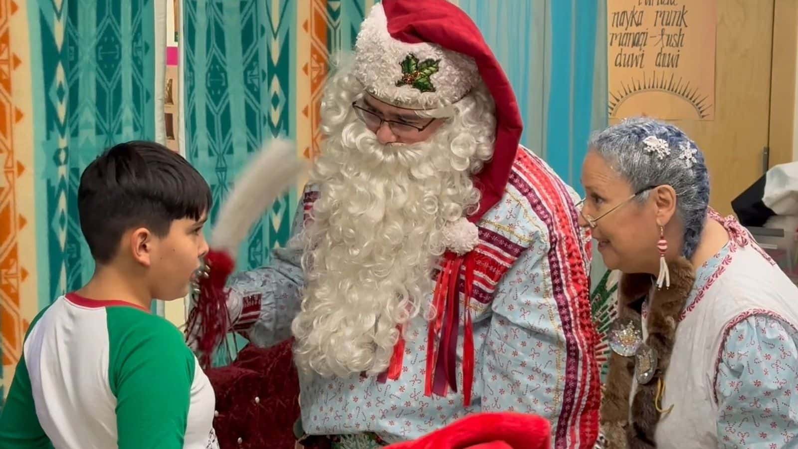 Solte Santa and Mrs. Claus talk to a boy about his wish list at the Chifin Native Youth Center in Springfield, Oregon, Sunday, Dec. 14, 2025. (Buffalo’s Fire/Brian Bull)