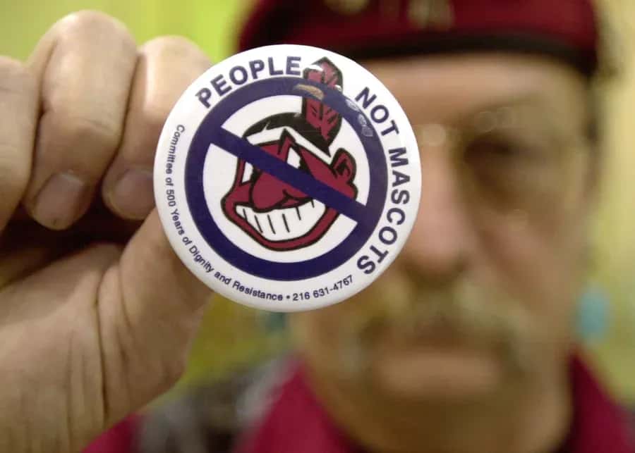 Powwow attendee Sonny Hensley holds an anti-mascot button to protest using Indians as mascots for sports teams at the 2003 New Years Eve Sobriety Powwow in Columbus, Ohio.
Mike Simons/Getty Images