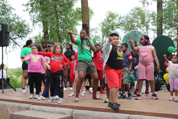 Geraldine Ambe, one of the organizers, led children in a dance onstage at Bismarck’s second Juneteenth celebration on June 19.
(Photo credit/Alicia Hegland-Thorpe)