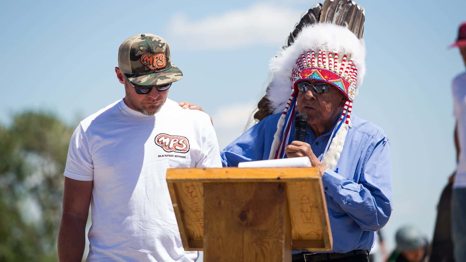 Blackfeet Nation Chief, Earl Old Person, gives Pearl Jam bassist and Big Sandy native, Jeff Ament, a traditional Blackfeet name for his contribution of a skate park to the community of Browning on June 25, 2015.