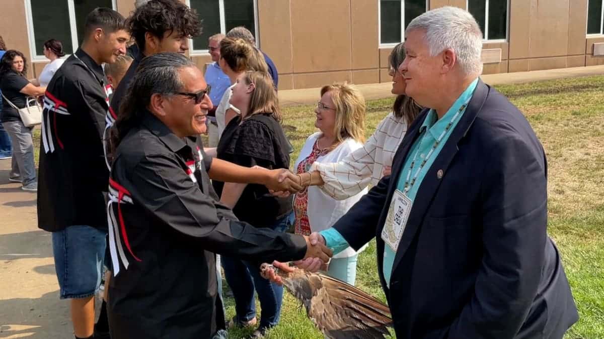 Mark Vargo, right, shakes hands with members of the Wambli Ska Society on Sept. 13, 2022, in Pierre. (Courtesy of SD Attorney General’s Office)