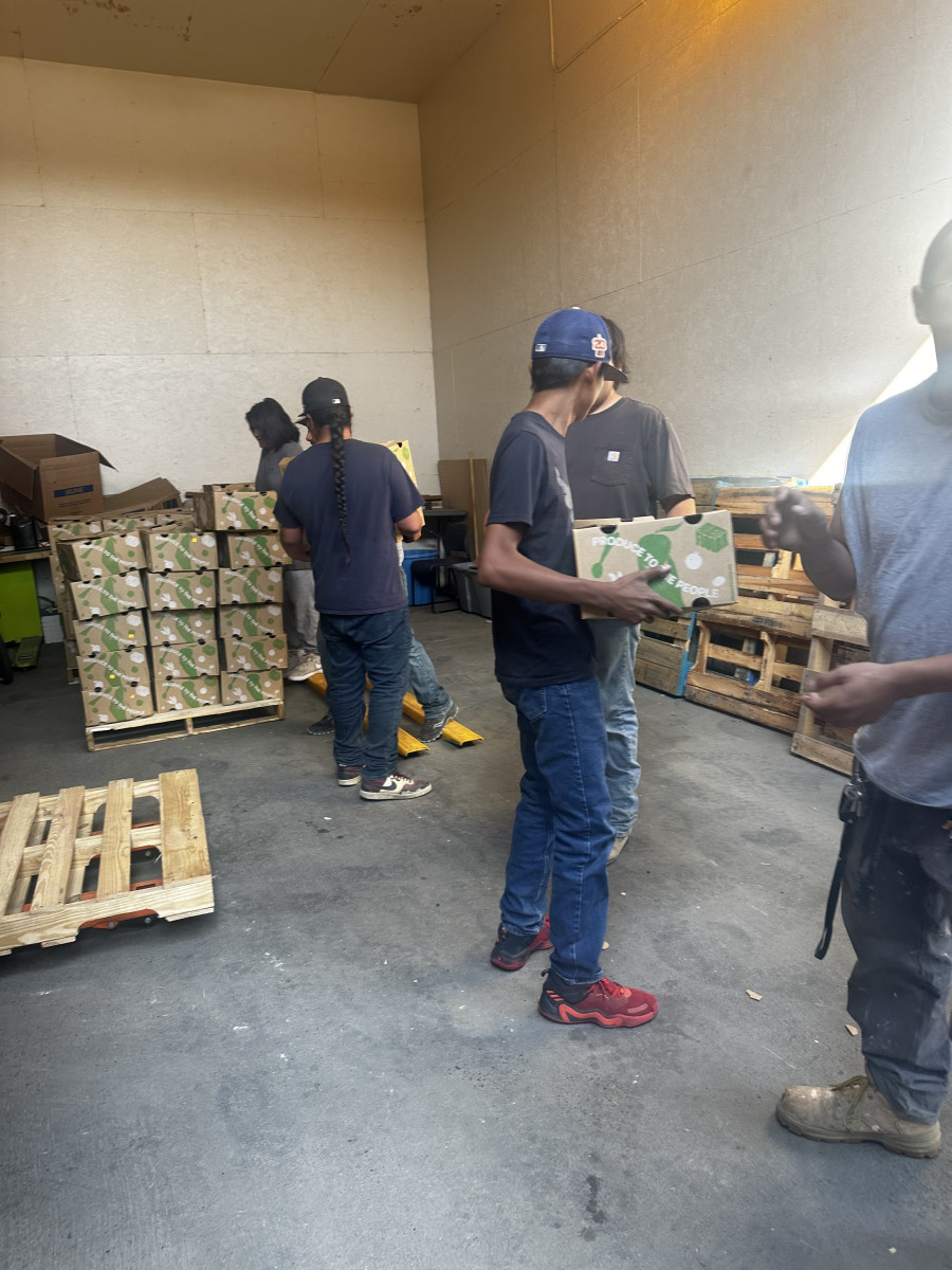 Native youth help unload produce for the Day Eagle Hope Project (Photo courtesy Tescha Hawley)