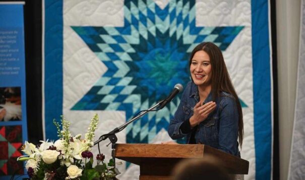 Megan Red Shirt-Shaw speaks at Dominican University in River Forest, Illinois, on Jan. 17, 2023. Two University of South Dakota faculty members, Megan Red Shirt-Shaw and her husband, John Little, have long included their gender pronouns and tribal affiliations in their work email signature blocks. But both received written warnings from the university in March that doing so violated a policy adopted by the South Dakota Board of Regents in December. (Ryan Pagelow/Dominican University via AP)