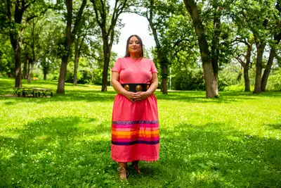 Jules Edwards poses for a portrait at Minnehaha Regional Park on June 25. (Nicole Neri for MPR News)