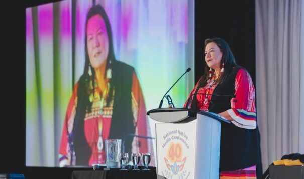 Jodi Rave Spotted Bear gives acceptance speech  for the Tim Giago Free Press Award at the National Native Media Conference in Winnipeg  on Aug. 12, 2023. (Photo credit/ Jodi Rave Spotted Bear)