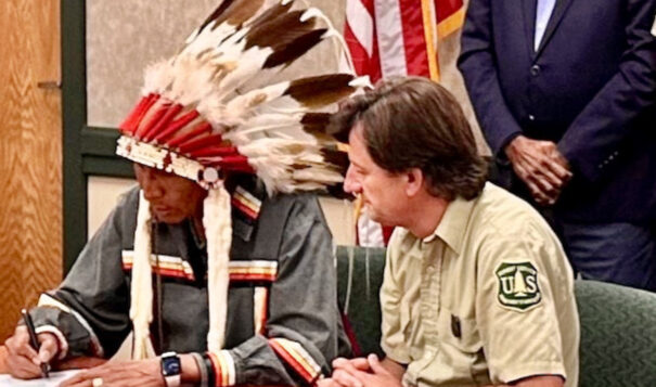 In Rapid City, South Dakota, on Aug. 22, Arvol Looking Horse signed the Great Sioux Nation and U.S. Forest Service MOU on Black Hills co-stewardship. Accompanying him was Black Hills National Forest Supervisor Shawn Cochran. (Photo credit/  Mark Van Norman)