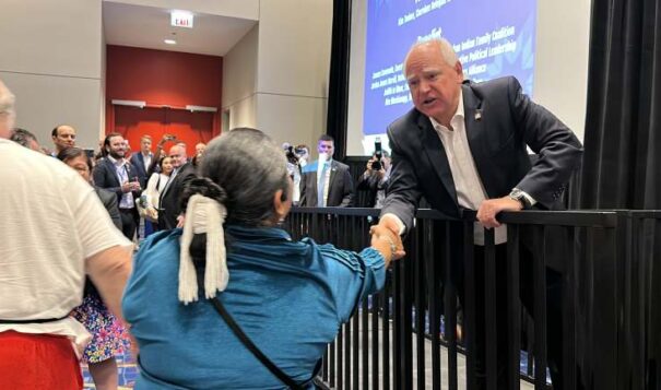 Minnesota Gov. Tim Walz shakes hands with Debbie Nez-Manuel, an elected delegate from Arizona, during the Native American Caucus meeting on Monday August 19, 2024 at the Democratic National Convention. Walz is the vice presidential running mate for Democratic presumptive presidential nominee Kamala Harris. (Photo by Pauly Denetclaw, ICT)