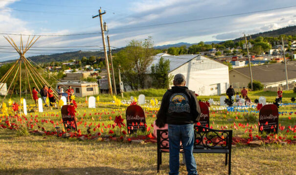 A couple stands overlooking NDN Collective's Wičaktepi Remembrance Garden in Rapid City. The garden was created to remember community members who died in fatal police-involved shootings in the city. (Photo by Amelia Schafer, ICT/Rapid City Journal)